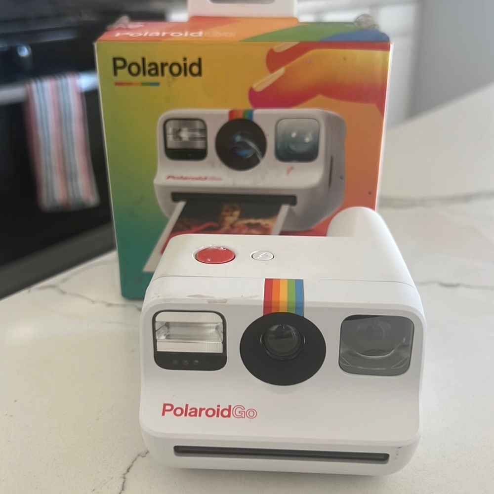 Polaroid camera with box, works perfectly and has a flash, just needs film.